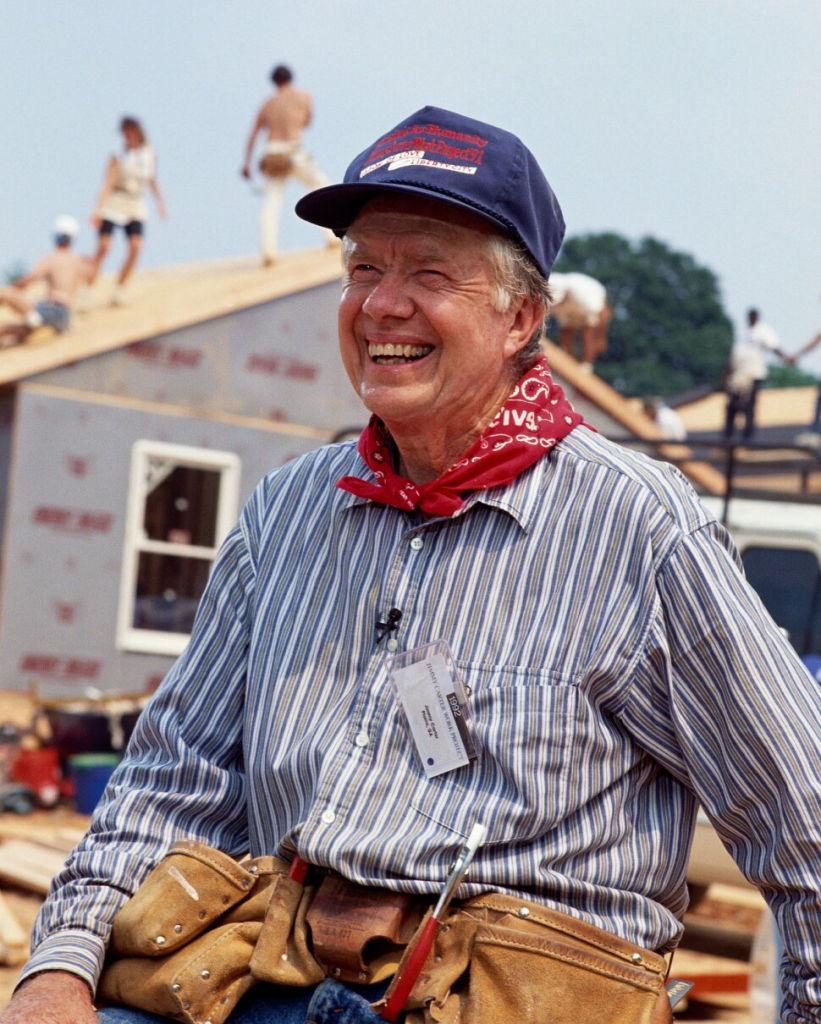 Former President Jimmy Carter working as a volunteer at a Habitat for Humanity construction site in 1992. (Photo by Mark Peterson/Corbis/Getty Images)